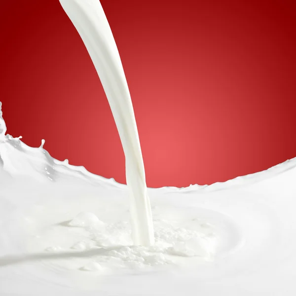 Pouring milk splash — Stock Photo, Image