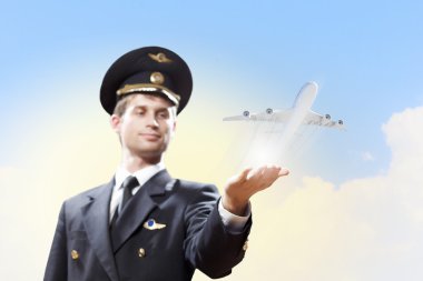 Image of pilot with plane in hand clipart