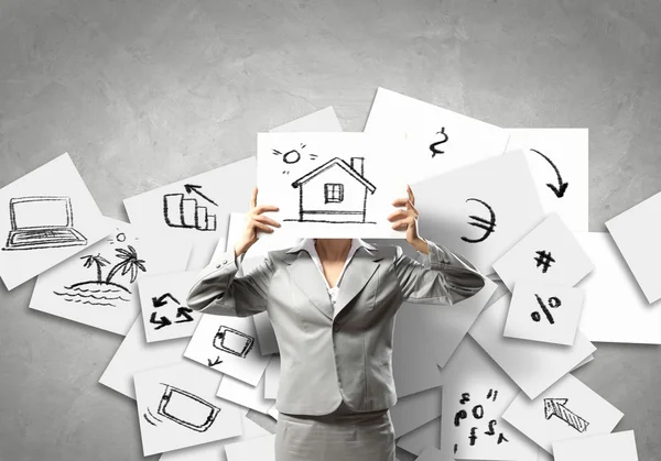 Business woman holding drawing — Stock Photo, Image