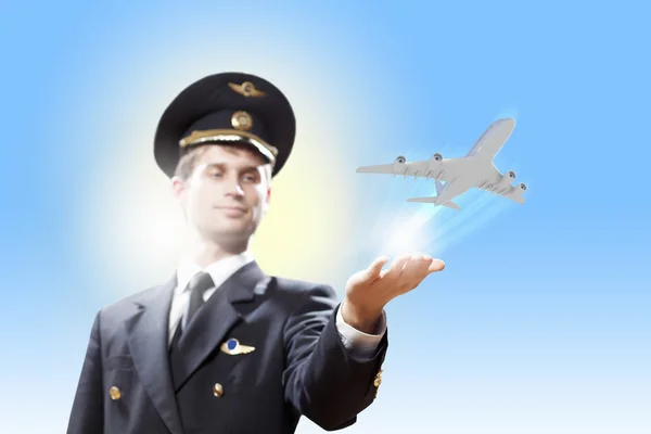 Image of pilot with plane in hand — Stock Photo, Image