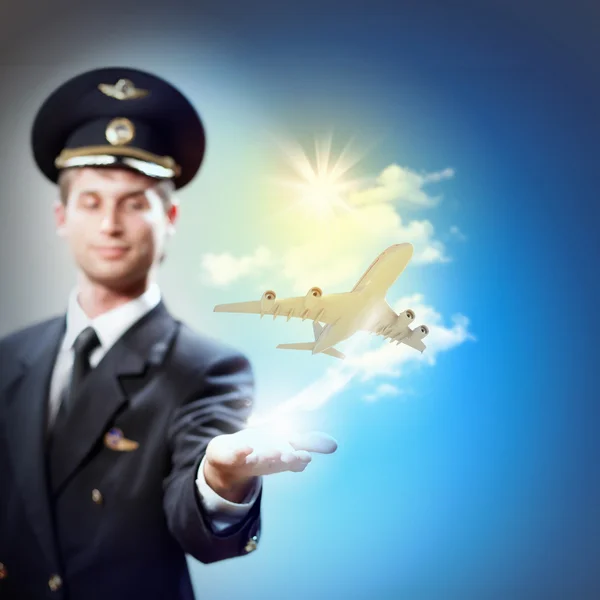 Image of pilot with plane in hand — Stock Photo, Image