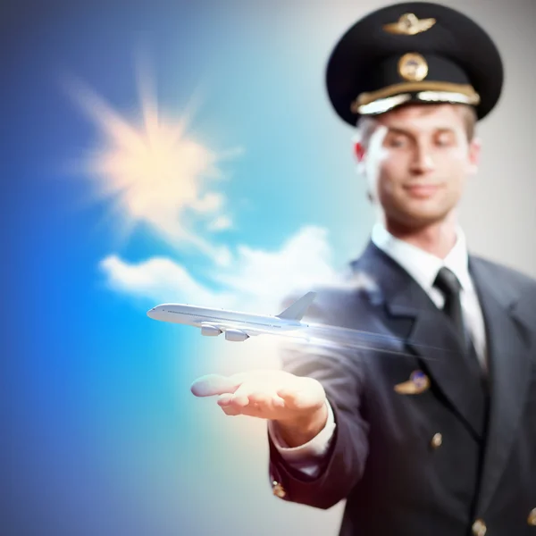 Image of pilot with plane in hand — Stock Photo, Image