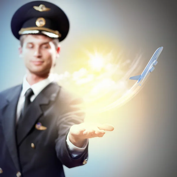 Image of pilot with plane in hand — Stock Photo, Image