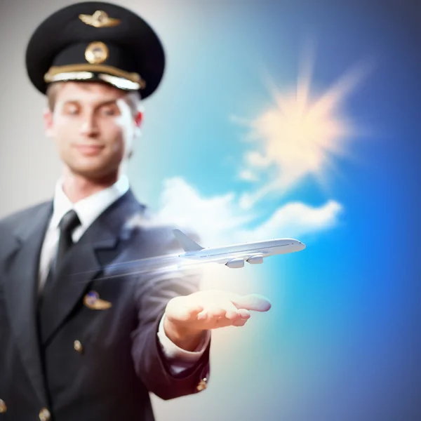 Image of pilot with plane in hand — Stock Photo, Image