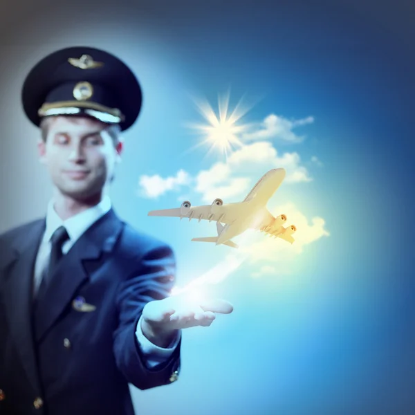 Image of pilot with plane in hand — Stock Photo, Image