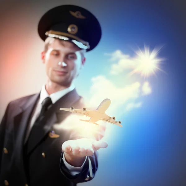 Image of pilot with plane in hand — Stock Photo, Image