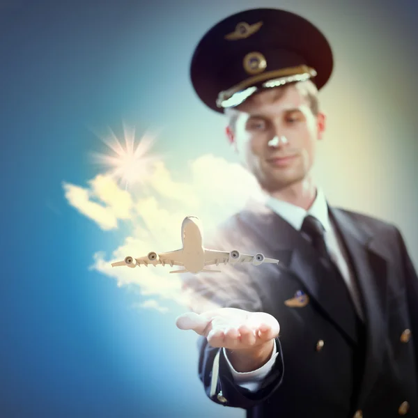 Image of pilot with plane in hand — Stock Photo, Image