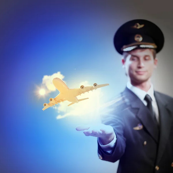 Image of pilot with plane in hand — Stock Photo, Image