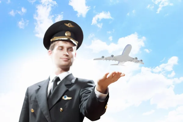 Image of pilot with plane in hand — Stock Photo, Image