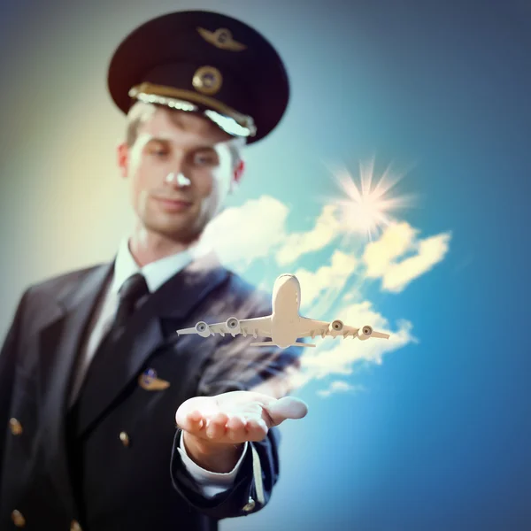Image of pilot with plane in hand — Stock Photo, Image