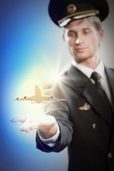 Image of pilot with plane in hand — Stock Photo, Image