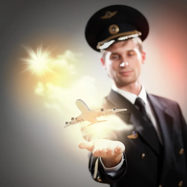 Image of pilot with plane in hand — Stock Photo, Image