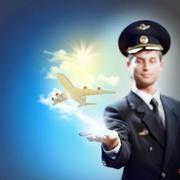 Image of pilot with plane in hand — Stock Photo, Image