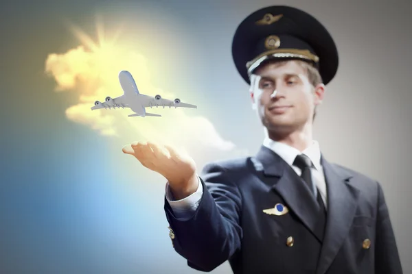 Image of pilot with plane in hand — Stock Photo, Image