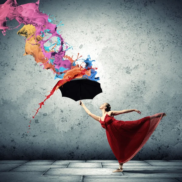 Ballet dancer in flying satin dress with umbrella — Stock Photo, Image