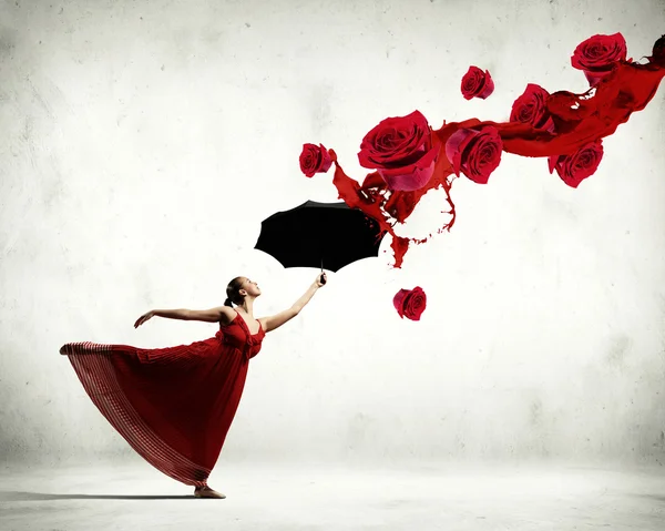 Ballet dancer in flying satin dress with umbrella — Stock Photo, Image