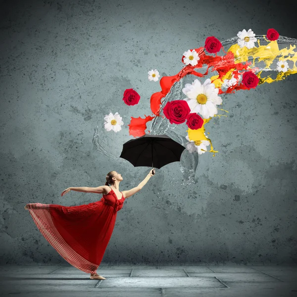 Ballet dancer in flying satin dress with umbrella — Stock Photo, Image