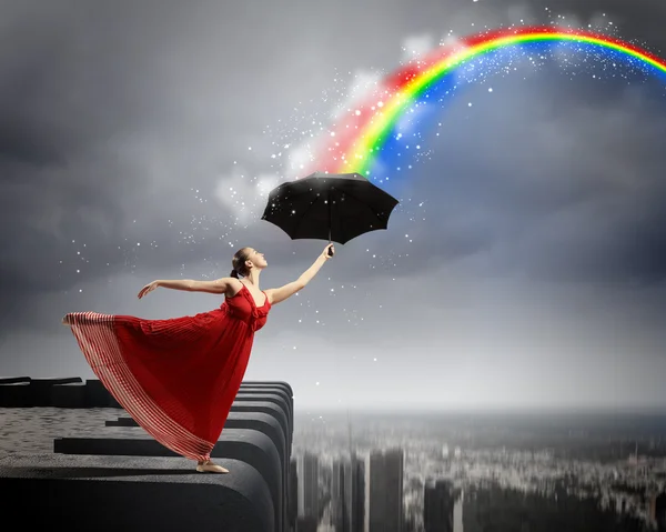 Ballet dancer in flying satin dress with umbrella — Stock Photo, Image