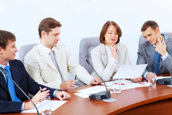 Cuatro empresarios en la reunión —  Fotos de Stock