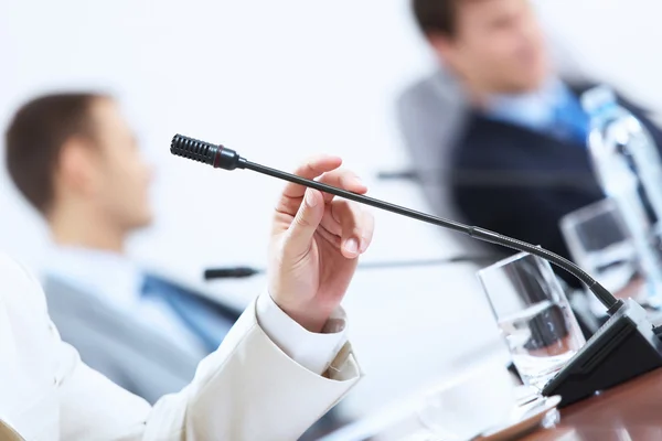 Hands of businessman holding microphone — Stock Photo, Image