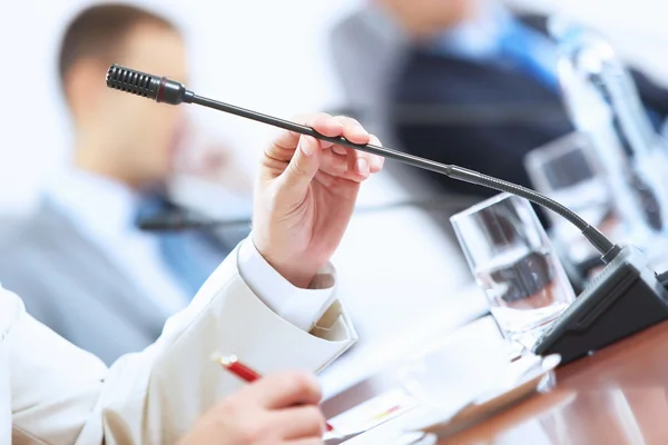 Hands of businessman holding microphone — Stock Photo, Image