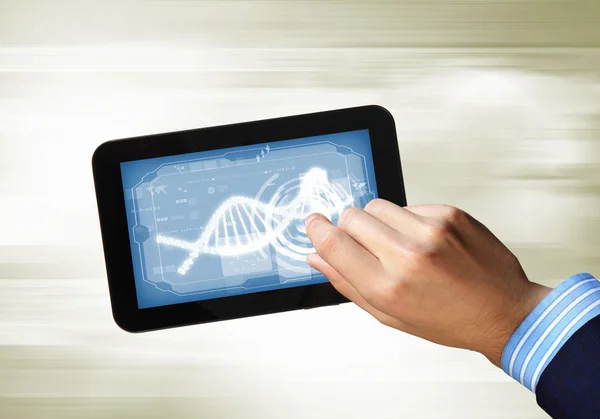 DNA-streng på tablettskjermen – stockfoto