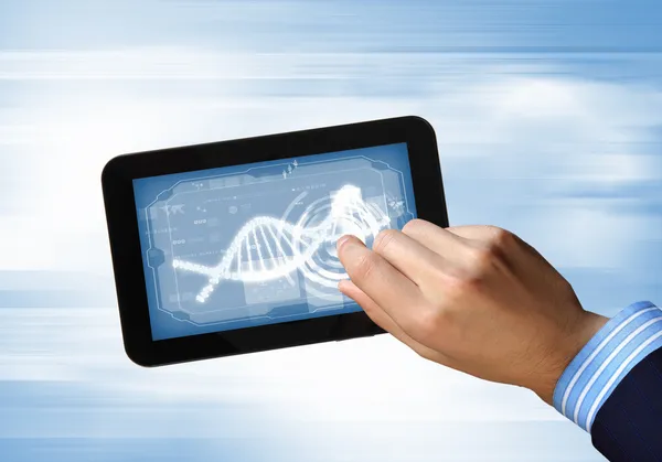 DNA strand på Tablet PC-skärmen — Stockfoto