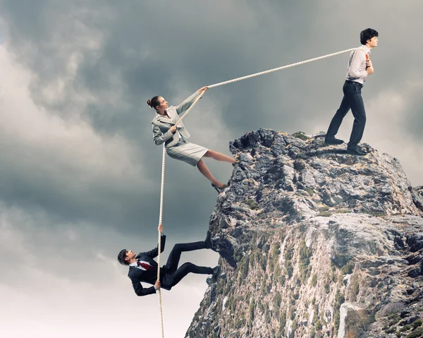 Three business pulling rope — Stock Photo, Image