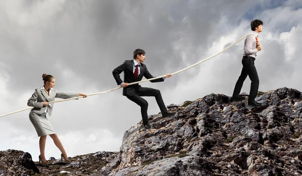 Three business pulling rope — Stock Photo, Image