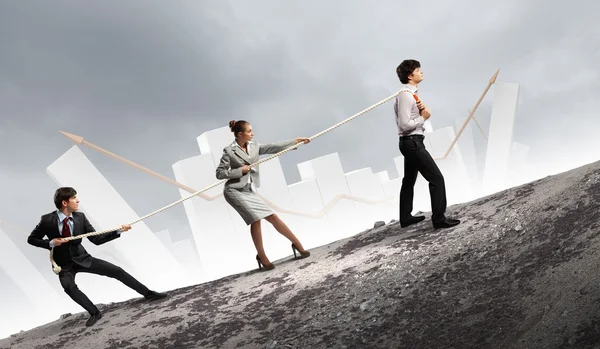 Three business pulling rope — Stock Photo, Image