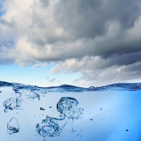 Sea wave with bubbles — Stock Photo, Image