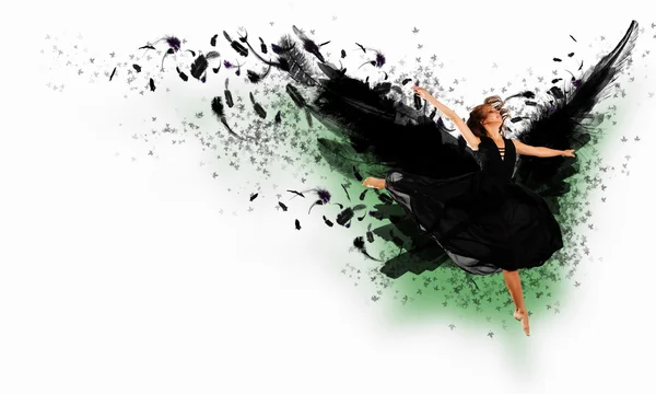 Woman floating on dark wings — Stock Photo, Image