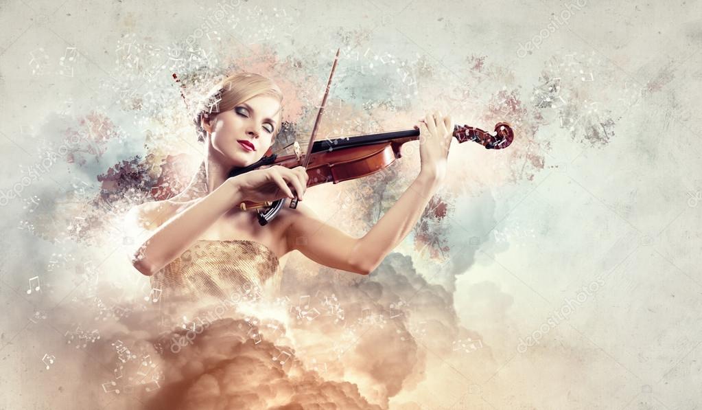 Gorgeous woman playing violin — Stock Photo © SergeyNivens #26258833