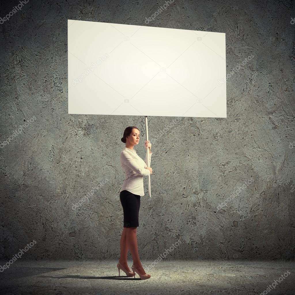 Woman holding blank board