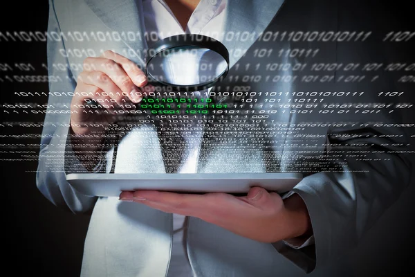 Businesswoman with magnifier glass — Stock Photo, Image