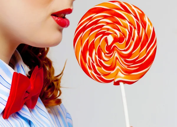 Young woman holding candy — Stock Photo, Image