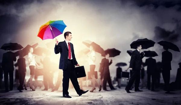 Businessman with umbrella — Stock Photo, Image