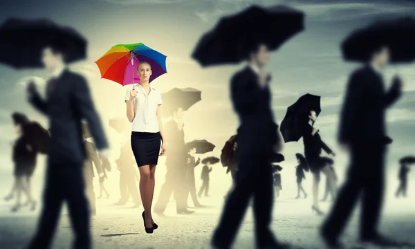 Businesswoman with umbrella — Stock Photo, Image