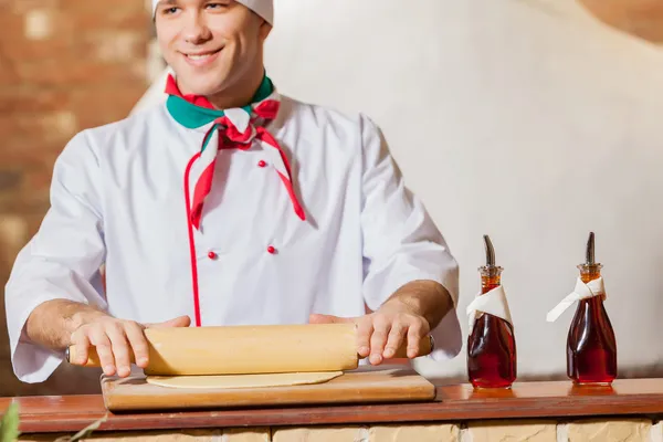 Chef rolling dough — Stock Photo, Image