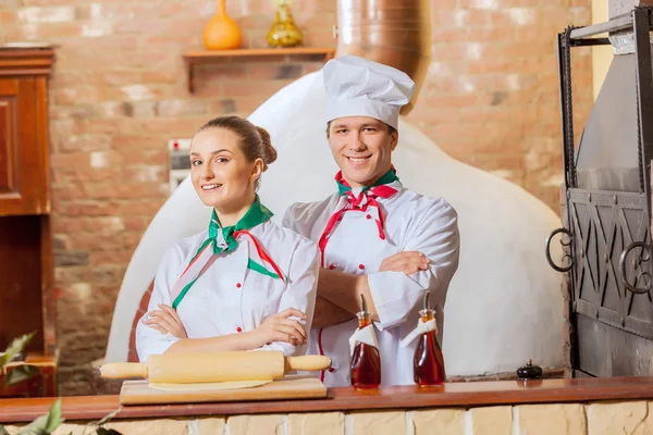 Portrait of two cooks with crossed arms — Stock Photo, Image