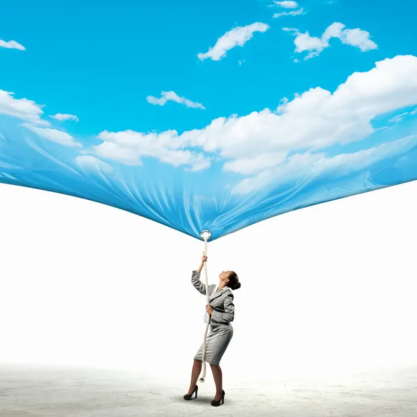 Businesswoman pulling banner — Stock Photo, Image