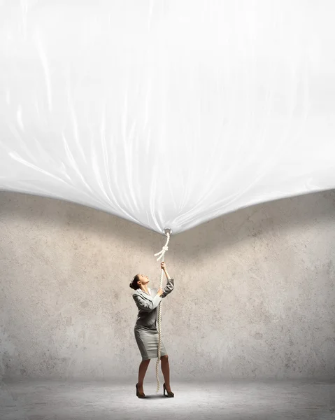 Businesswoman pulling banner — Stock Photo, Image