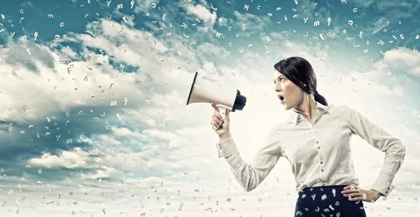 Businesswoman screaming in megaphone — Stock Photo, Image