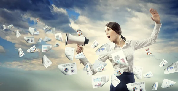 Businesswoman screaming in megaphone — Stock Photo, Image