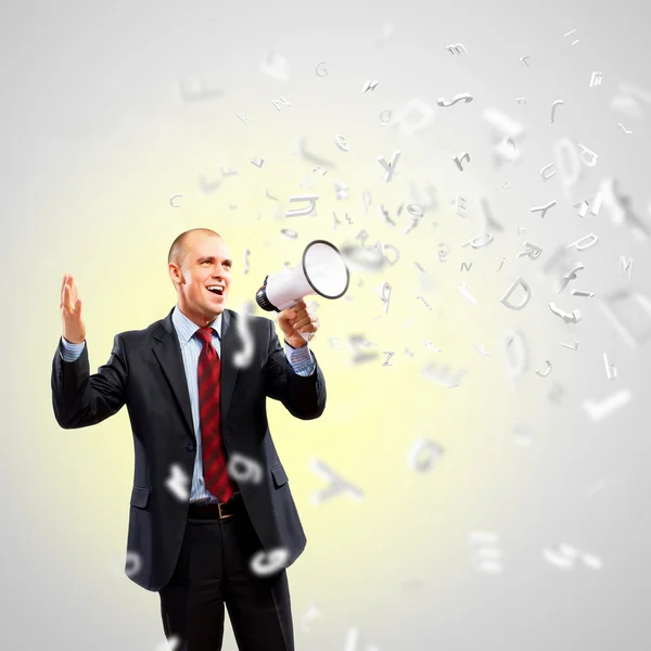 Businessman with megaphone — Stock Photo, Image