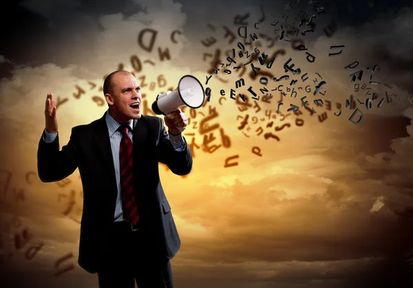 Businessman with megaphone — Stock Photo, Image