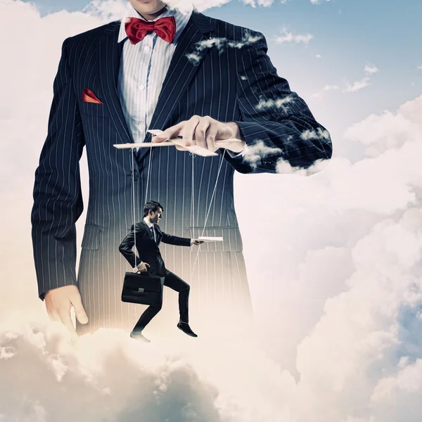 Businessman puppeteer — Stock Photo, Image
