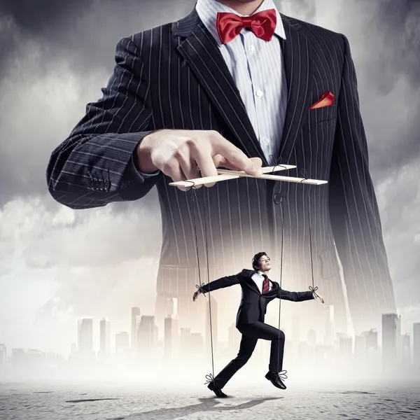 Businessman puppeteer — Stock Photo, Image