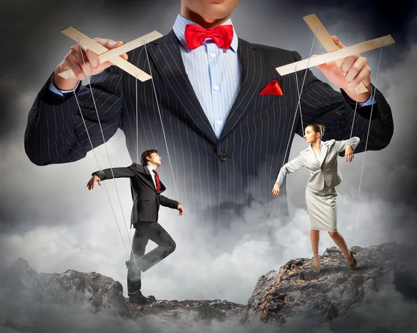 Businessman puppeteer — Stock Photo, Image