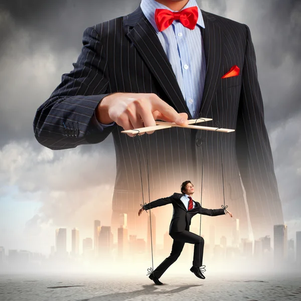 Businessman puppeteer — Stock Photo, Image